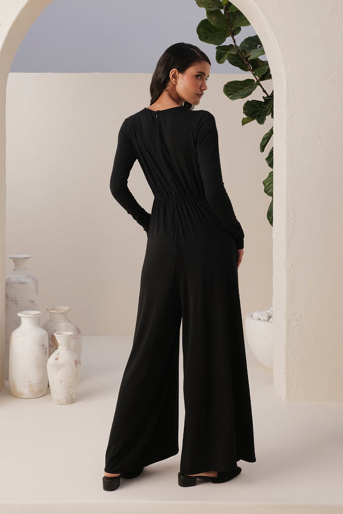 Sand Skin Black Jumpsuit Ankle To Long Length With A Narrow Round Neck, And Long Sleeves 