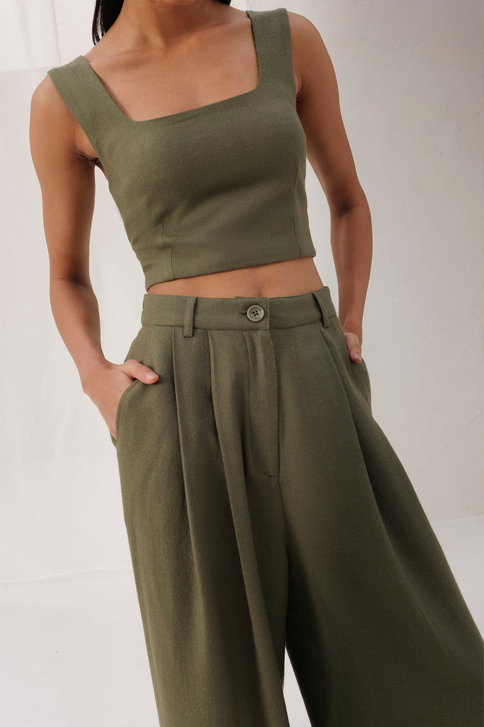 Moss Color Wide Legged Long Woollen Pants With Front Pleats And Side Pockets.