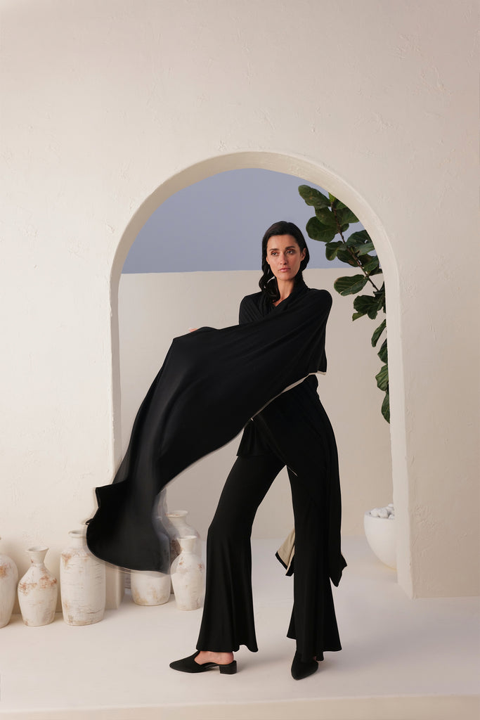 Black T-shirt With Black Flared Pants Paired With Black & Natural Reversible Shawl In Sand Skin