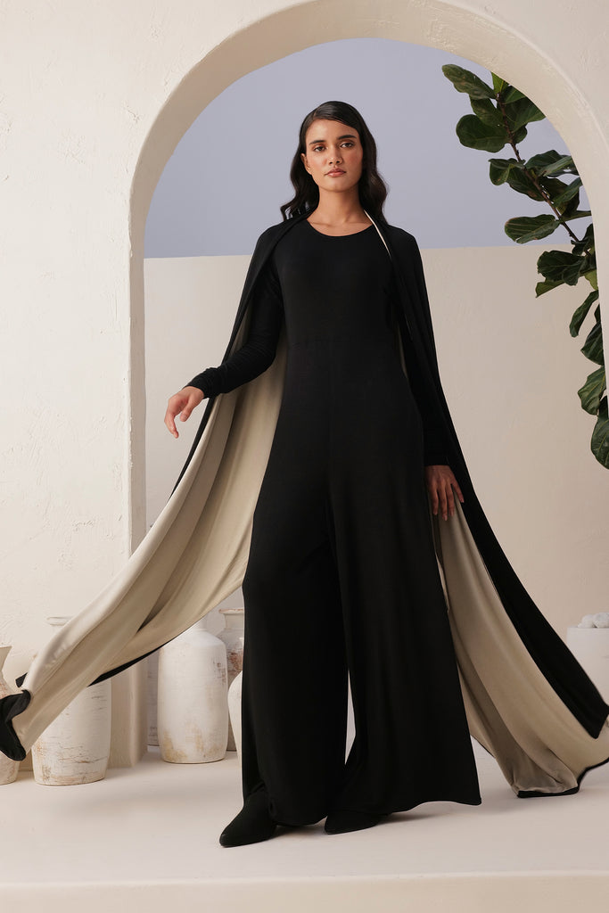 Sand Skin Black Jumpsuit Ankle To Long Length With A Narrow Round Neck, And Long Sleeves 