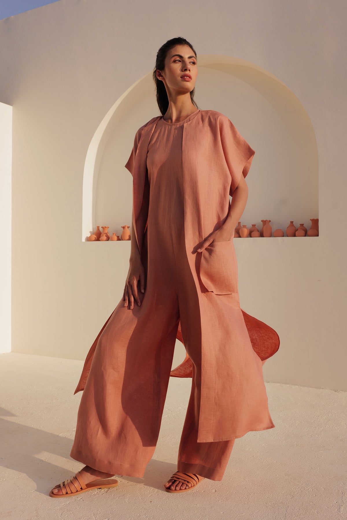Woman wearing a terracotta wide-leg jumpsuit